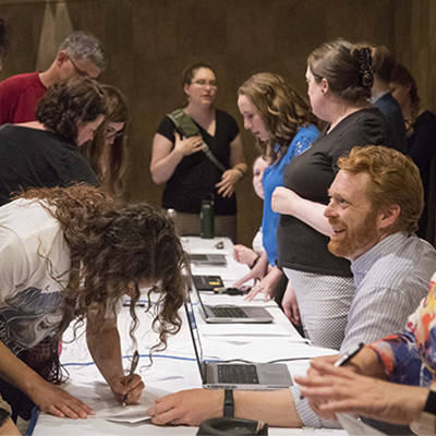 A student completes paperwork at New Student Orientation