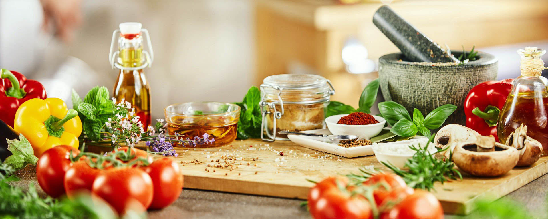 closeup of food being placed onto a dinner plate by a Chef