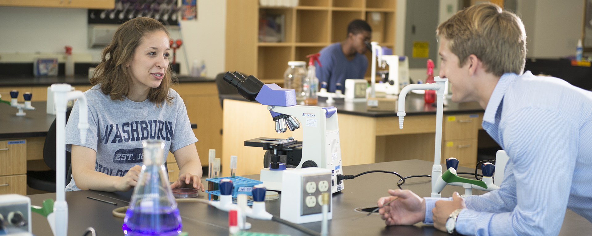 Two students work on an experiment in the lab.