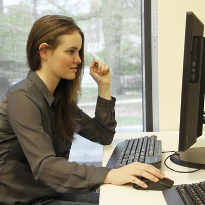 student at desk with computer