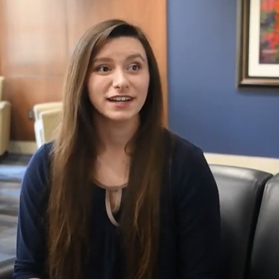 Mass Media Film student Darria Dennison sits on a chair