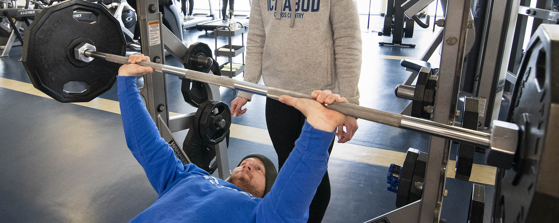 Student bench presses at the SRWC.