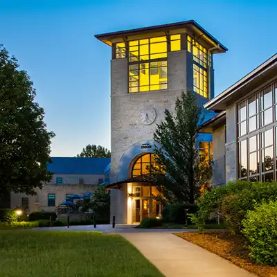 Memorial Union NE entrance tower exterior at dusk