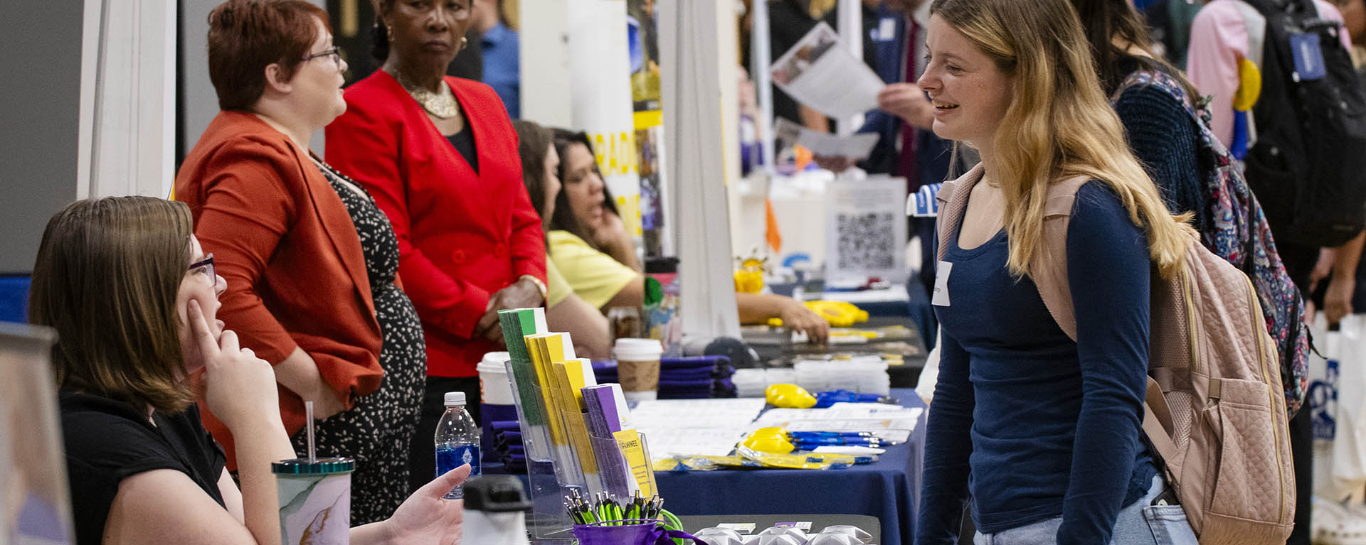 A student talks with a prospective employer during the healthcare career fair.