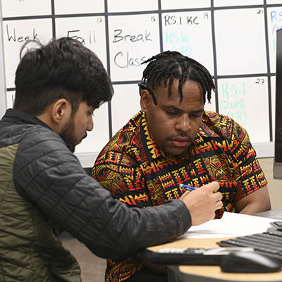 A student and their tutor work on an assignment in the math lab.