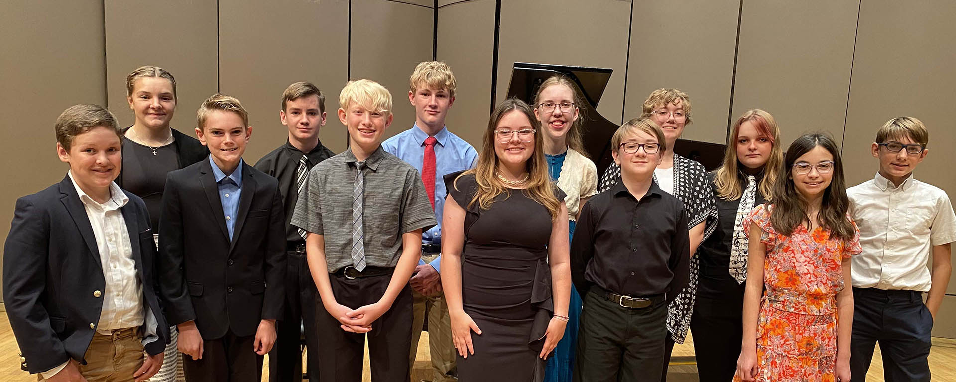 A group of keyboard academy students pose for a photo before their performance.