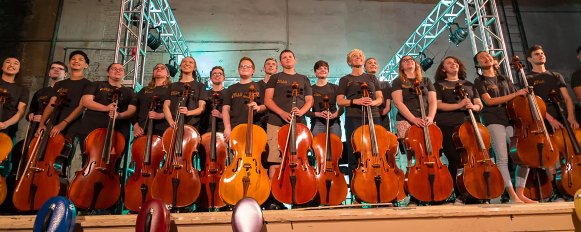 Cello concert performers on stage.