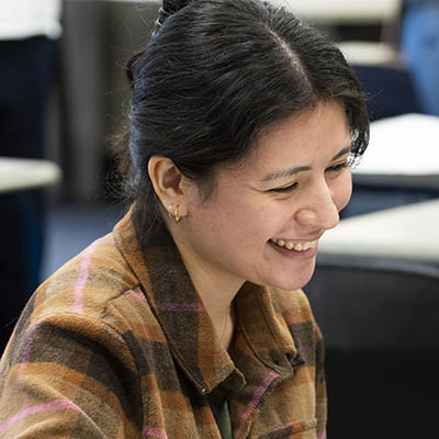 student smiles during a Sociology class.