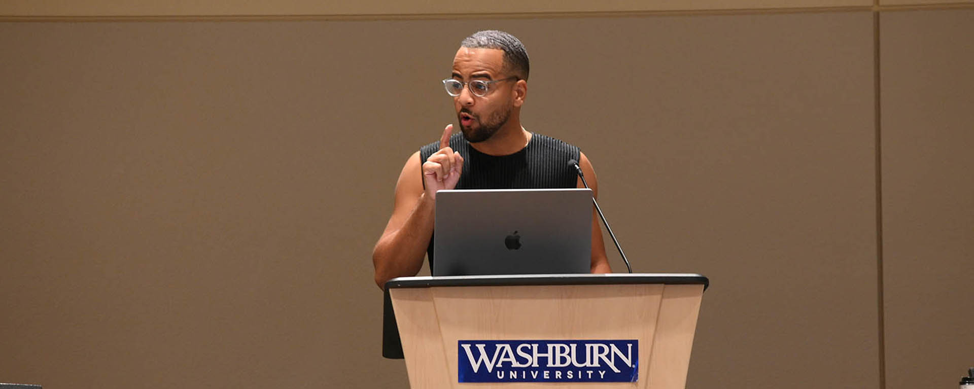 speaker, Royel Johnson, at podium during Tilford Conference