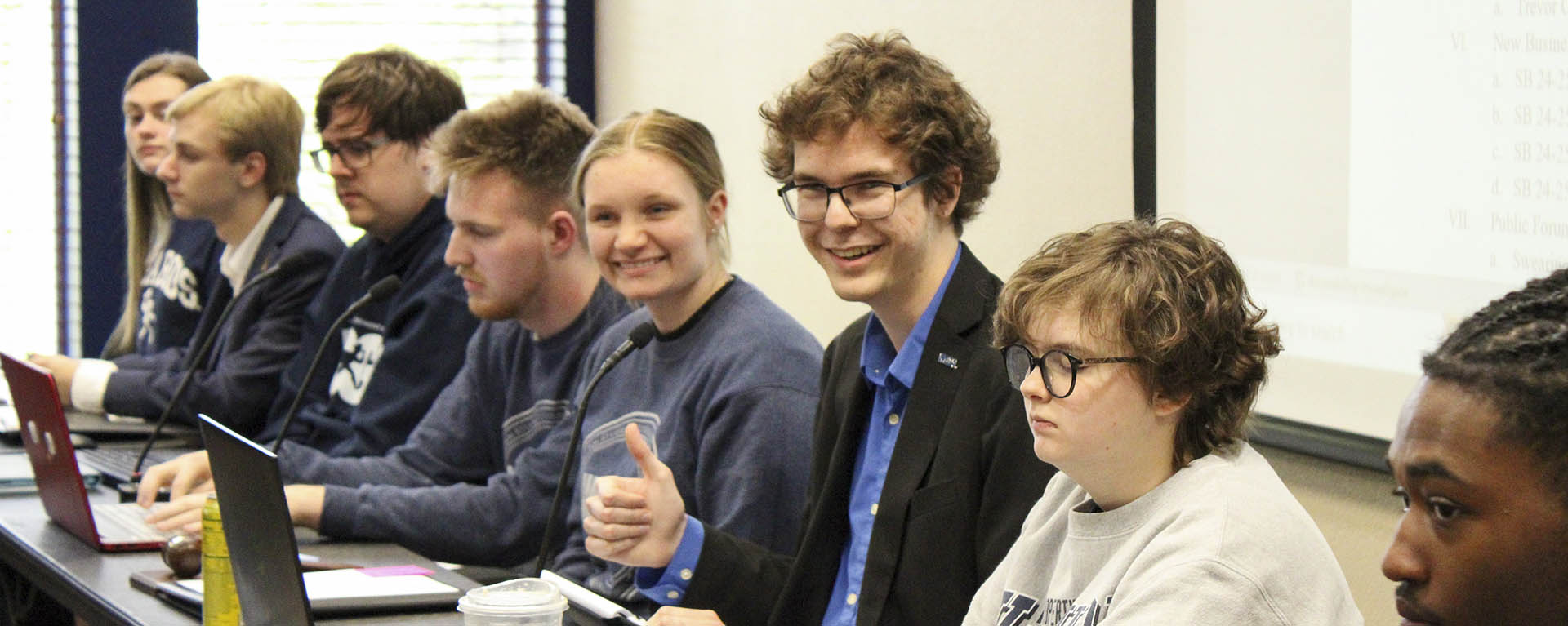 WSGA cabinet members smile during a meeting.