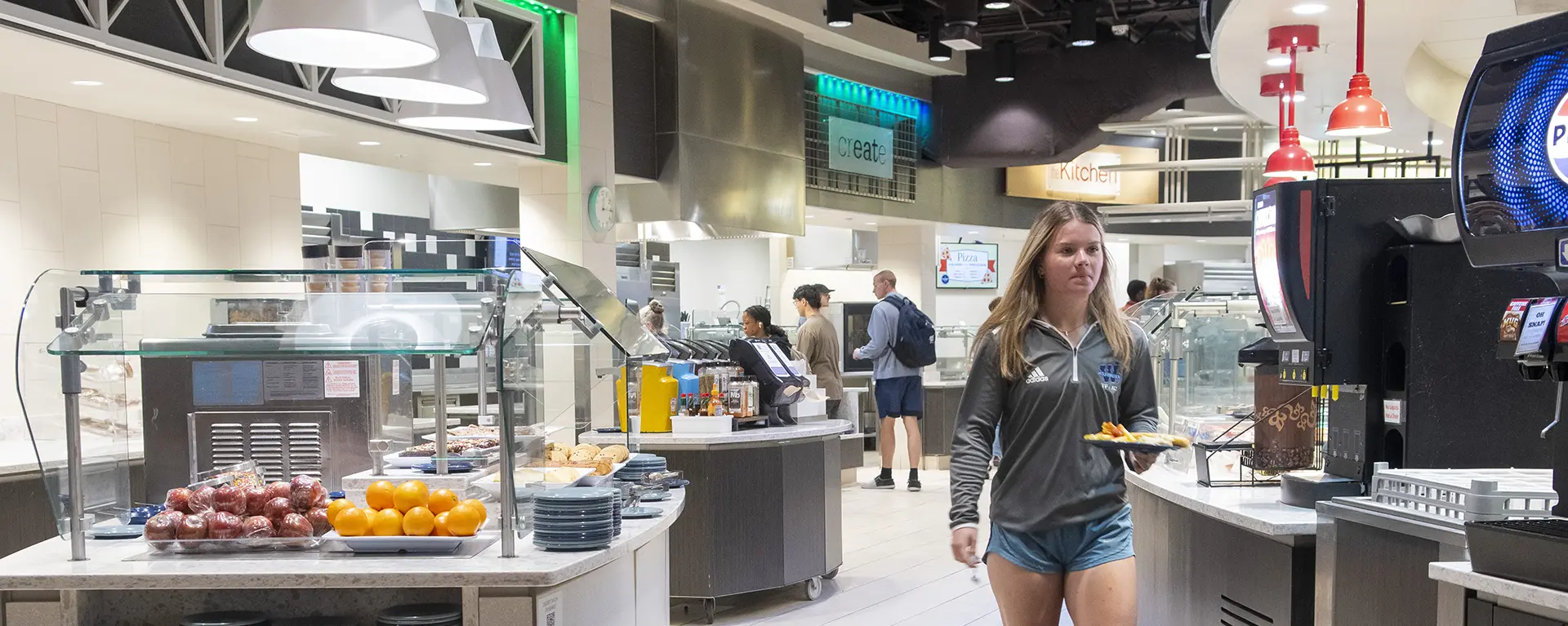 A Washburn student grabs some food in the Lincoln Dining Hall.