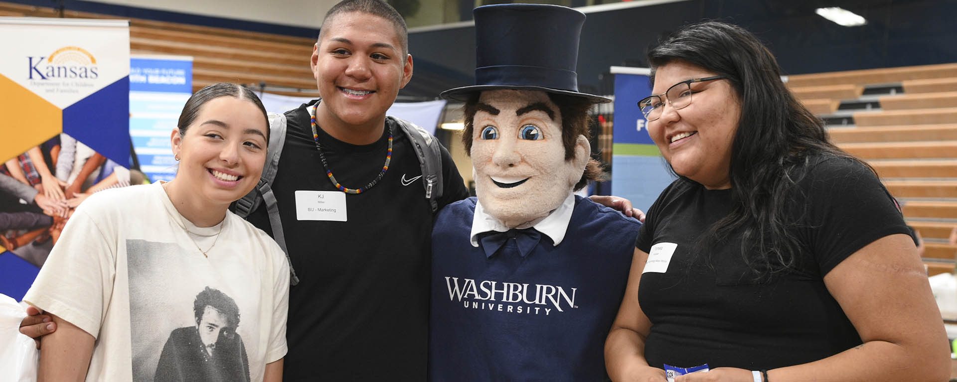 Mr. Ichabod poses with incoming students at an event.