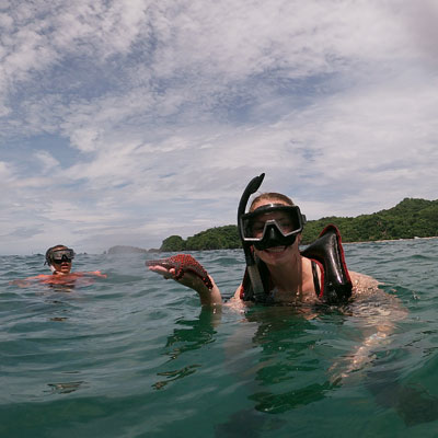 Holding a starfish found while snorkeling in the Gulf of Nicoya