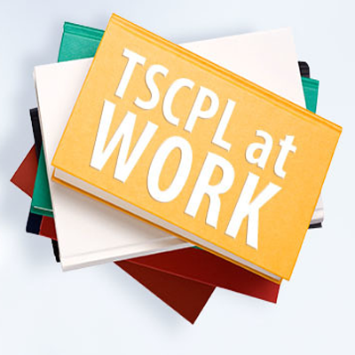 A stack of books with "TSCPL @ Work" written on top